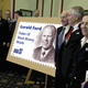 Officials unveil a new commemorative Gerald Ford stamp.